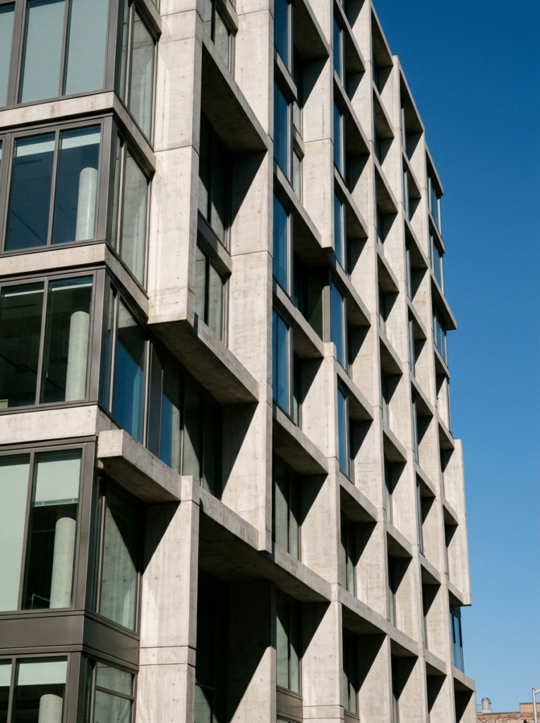 Пример по промту: Photorealistic architecture photo: a modern building with a rhythmic concrete and glass fa